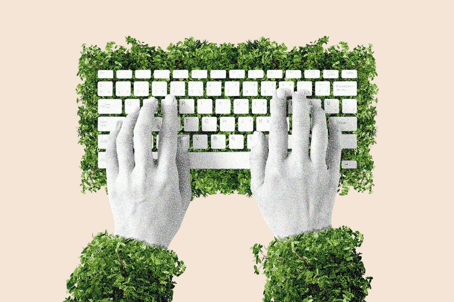 Hands typing on a keyboard covered in greenery